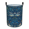 A dark blue floral patterned laundry hamper with black handles.