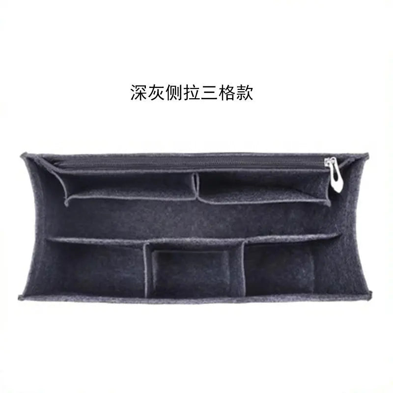 A dark gray felt bag organizer insert with multiple internal compartments.