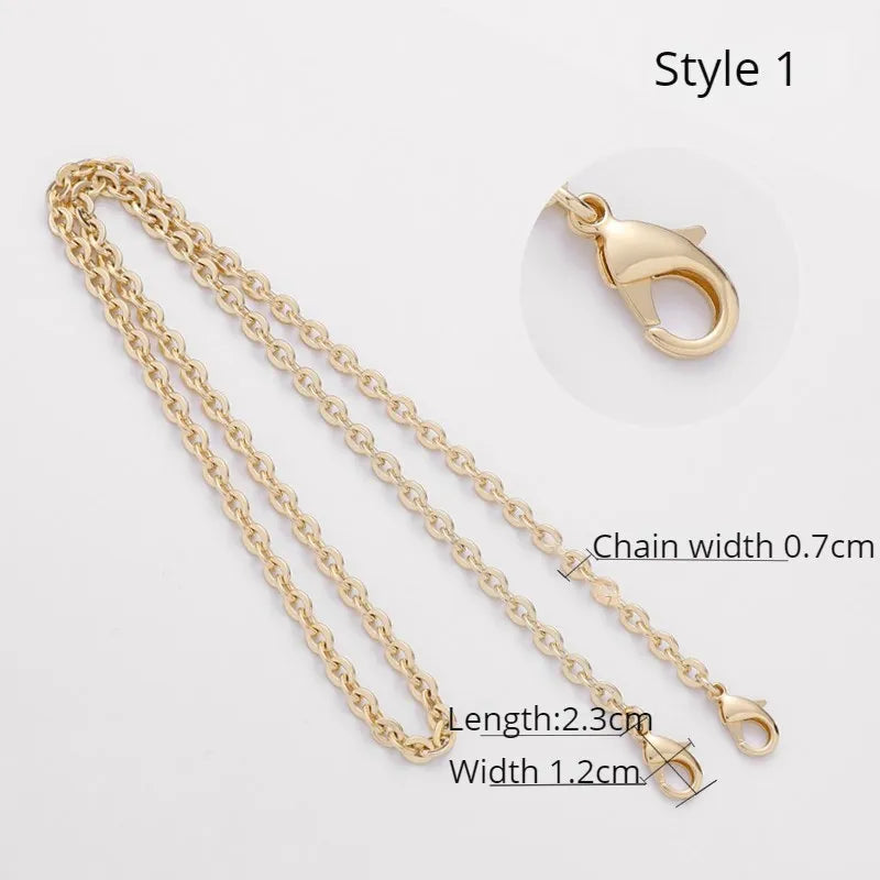 Gold chain bag strap with a pendant, shown in Style 1.
