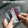 A hand holds a slim aluminum metal ID card wallet displaying multiple bank cards.