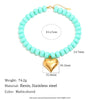 A light blue bead necklace featuring resin and stainless steel heart charms.