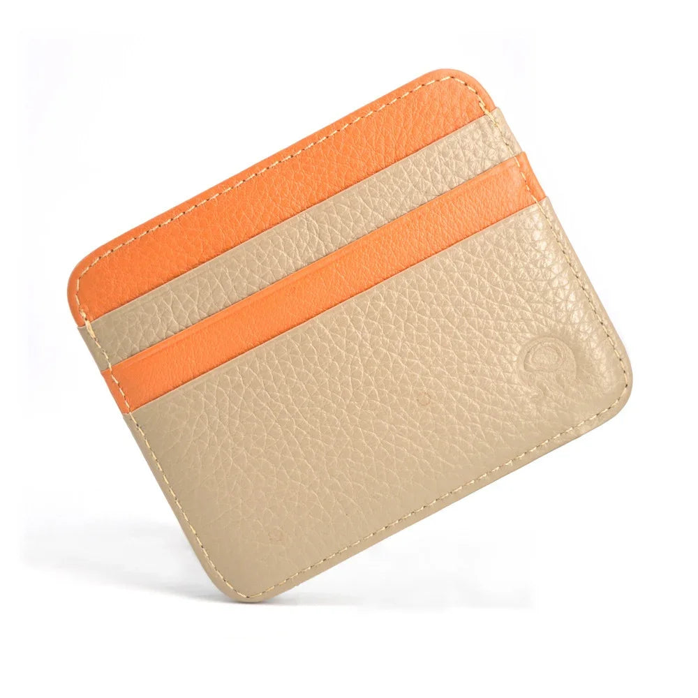 A genuine leather slim card holder wallet with three horizontal orange stripes on a beige background.