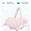 A light pink quilted puffy tote bag is shown against a white background, highlighting its ultimate softness and lightweight p