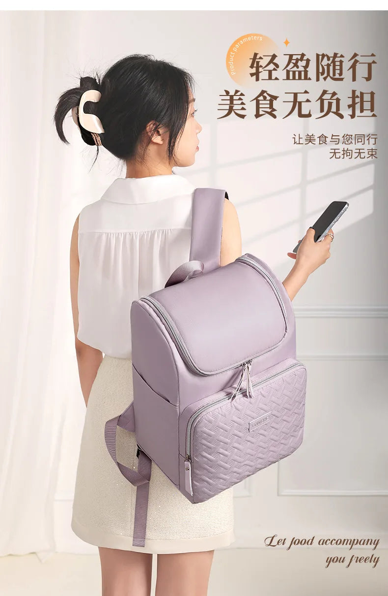 A woman is carrying a light purple insulated picnic cooler backpack while wearing a white top and skirt.