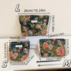 A set of three elegant vintage cosmetic pouches in floral patterns shown with measuring tools.