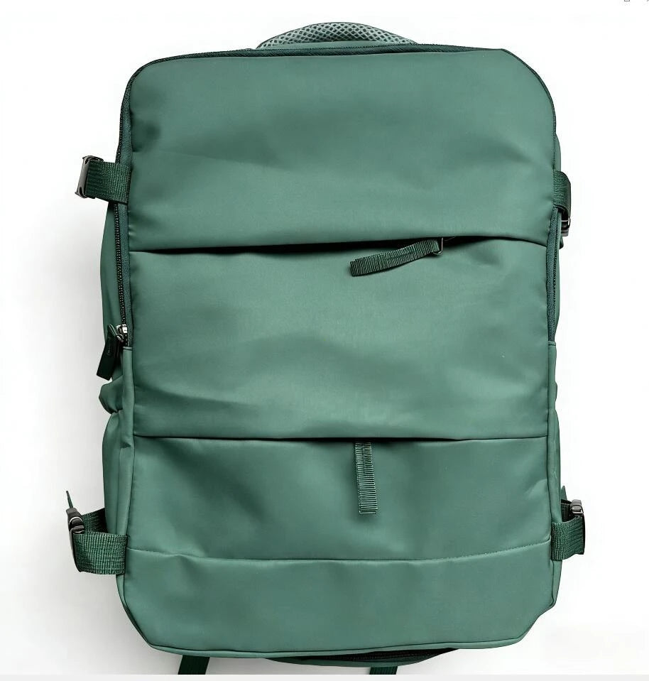 A dark green compact travel backpack shown from the back.