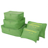 A set of three olive green mesh laundry pouches for travel organization.