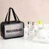 A black toiletry bag with a handle is shown next to various skincare and hygiene products.