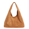 A tan suede shoulder tote bag with a tapered shape.