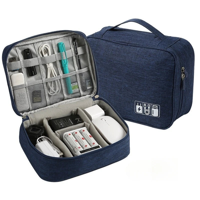 A dark blue leather cable storage organizer bag is shown open, revealing various electronic cables and accessories inside.