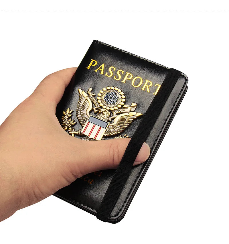 A hand holds a black leather passport holder featuring a gold US Eagle badge and the word PASSPORT