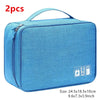 A light blue portable digital organizer storage pouch with a zipper and handle.
