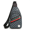 A dark gray printed Gucci monogram crossbody sling bag with green, red, and black stripes and a black strap.