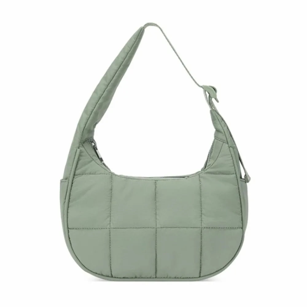 A light sage green quilted nylon shoulder bag with an adjustable strap.