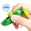 A hand holds a green fidget toy keychain with a small green frog, next to a speech bubble saying hello.