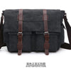A black canvas messenger bag for men with brown leather straps and buckles.