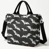 Black tote bag featuring a white bat print with a black strap.