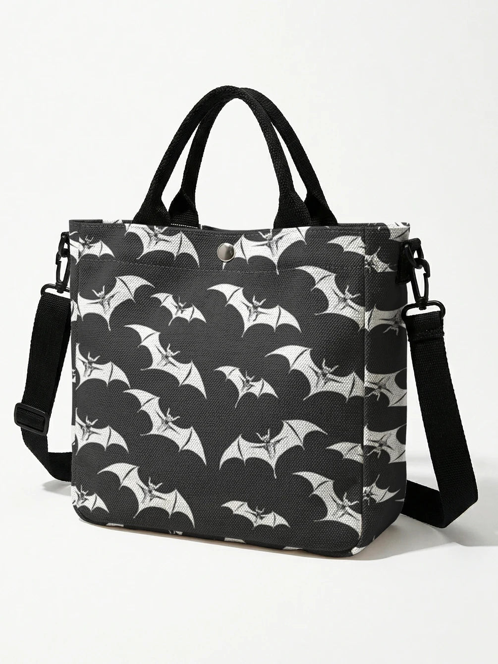 Black tote bag featuring a white bat print with a black strap.