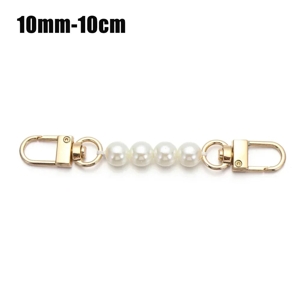 A delicate pearl strap with gold-toned clasps and a 10mm to 10cm length.