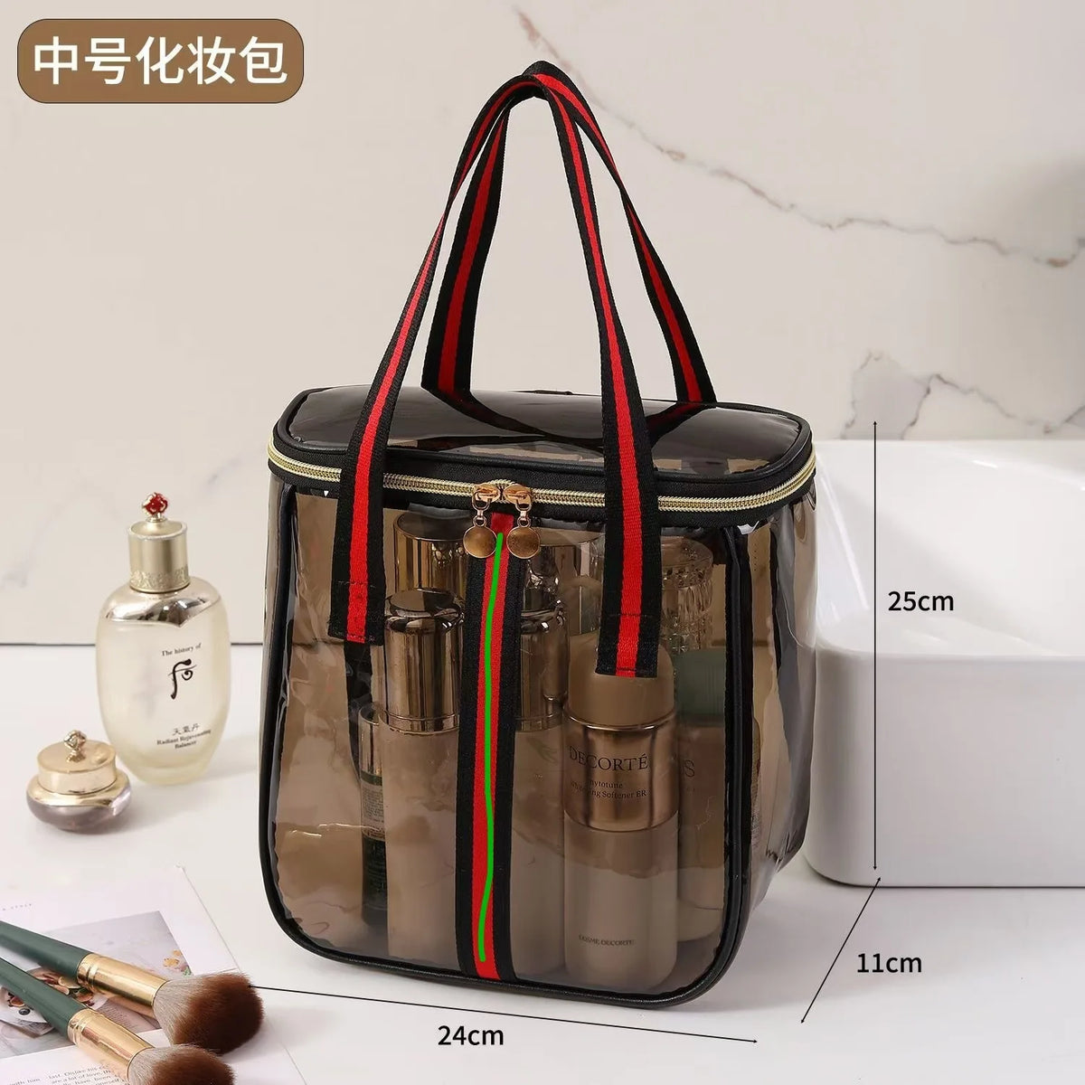 A clear waterproof travel toiletry bag with black and red straps, showing various grooming products inside.