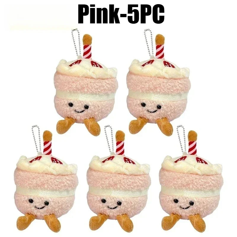 Five pink bread plush keychains with white frosting and striped straws