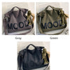 Three canvas tote bags in gray, green, and black featuring a mood design and a small figurine.