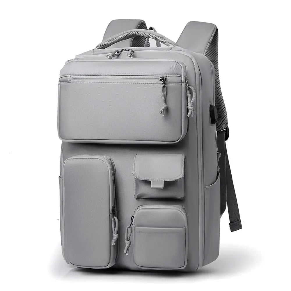 A gray unisex large capacity travel backpack shown from the front.