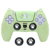 A lime green silicone grip cover for a PlayStation controller featuring a cat design.