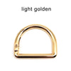 A gold-colored D-shape metal spring ring clasp for bags and keychains.