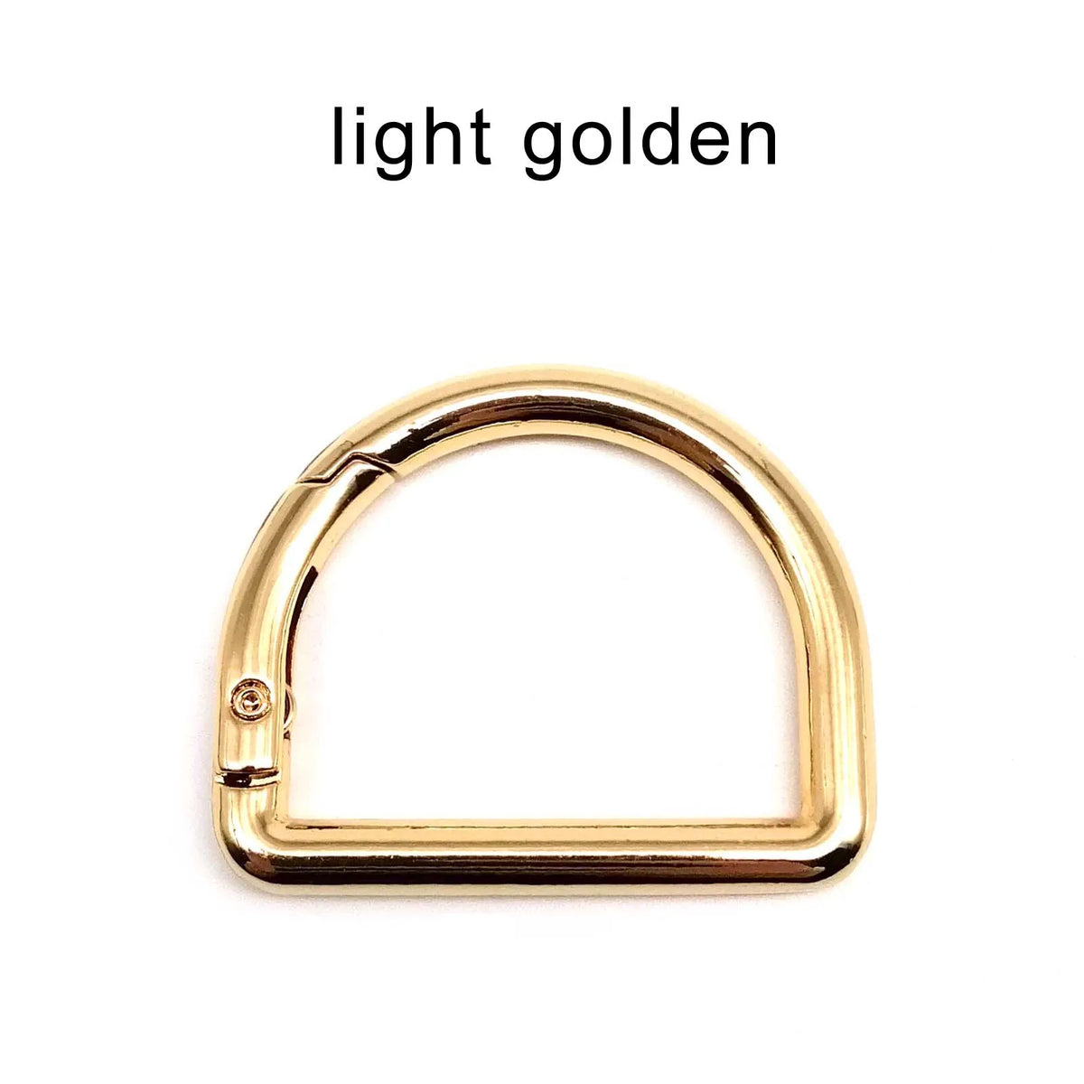A gold-colored D-shape metal spring ring clasp for bags and keychains.