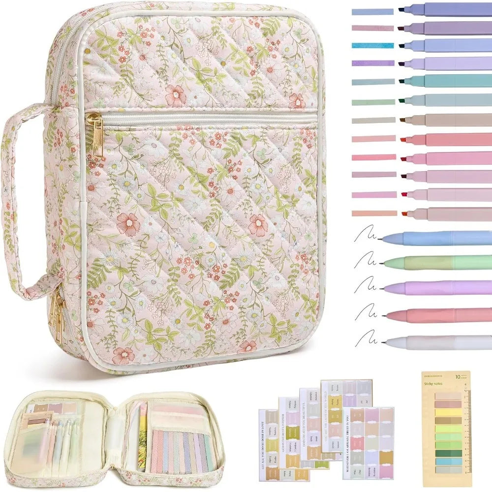 A quilted floral bible cover with a built-in pen holder and a set of colored pens.
