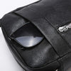 Black waterproof PU leather sling bag featuring a clear lens case and silver zipper detail.