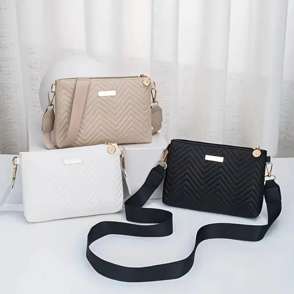 A beige quilted chain crossbody bag and a black quilted chain crossbody bag are displayed on a white surface.