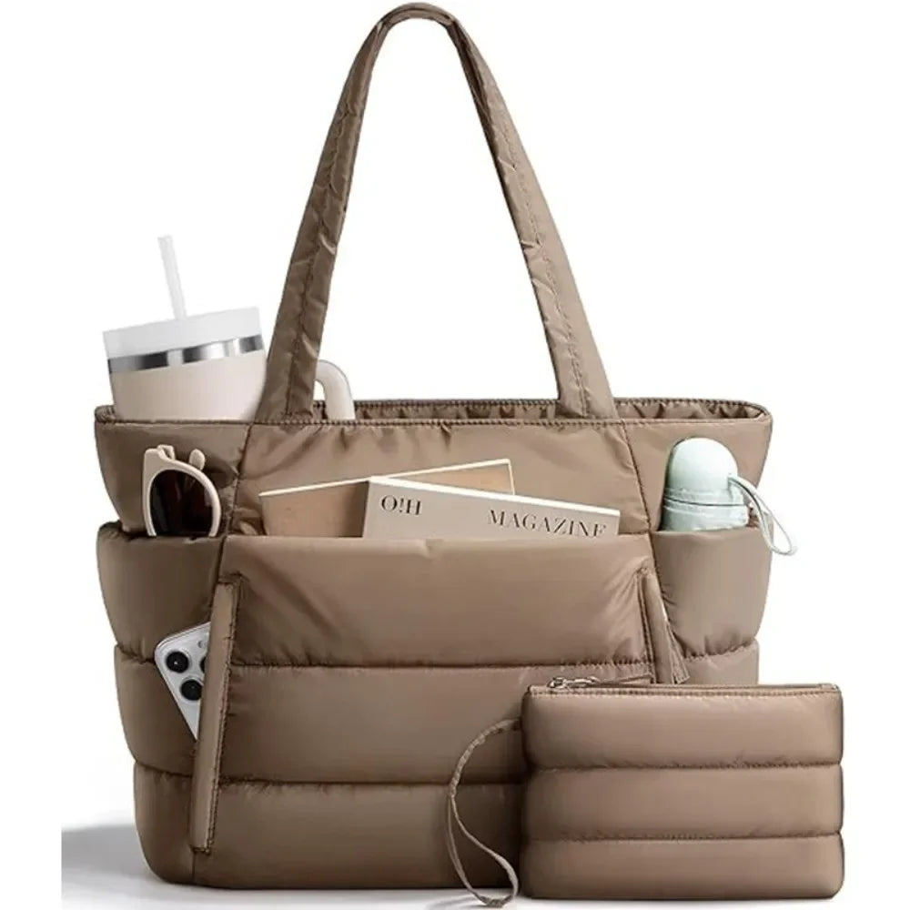 A beige quilted puffer tote bag with pockets and a matching pouch resting on a white surface.