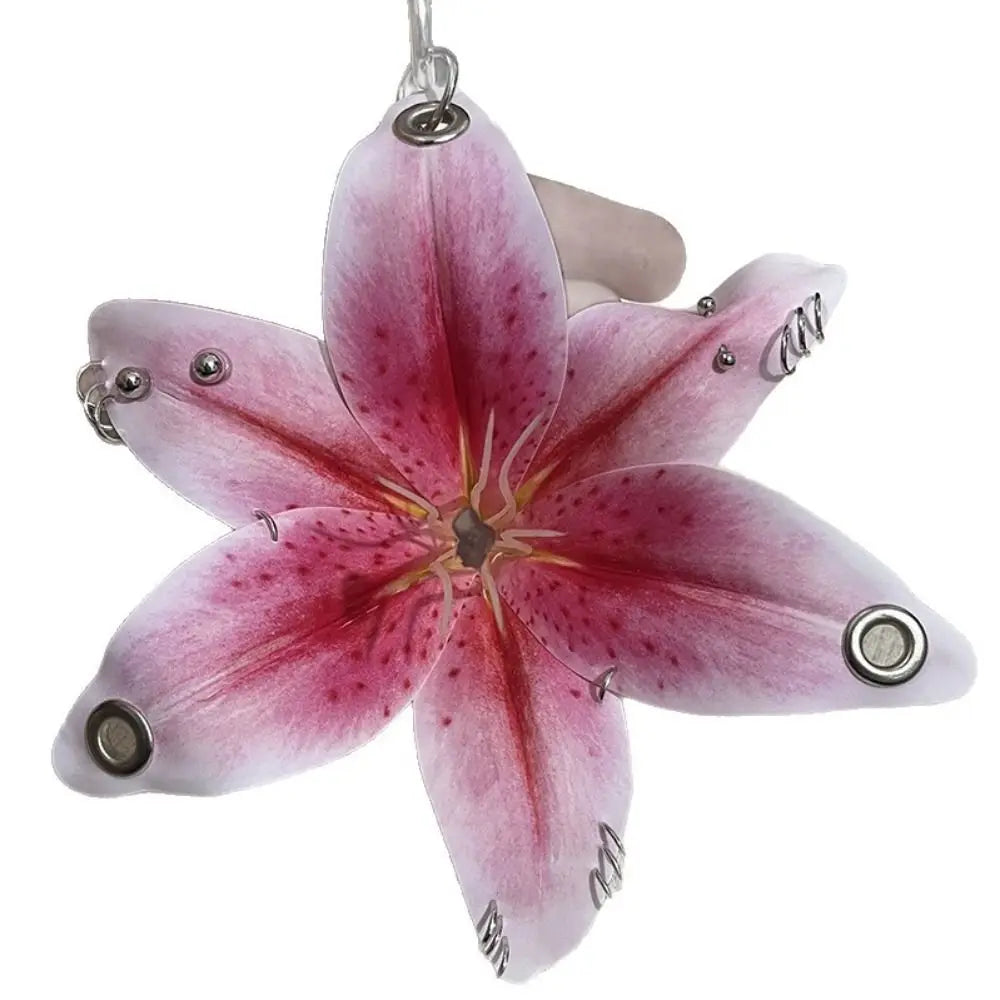 A realistic pink orchid flower keychain with delicate petals and a stem.