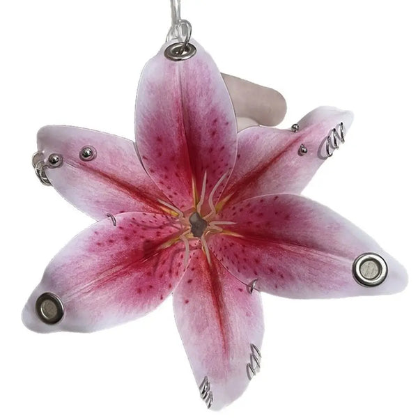 A realistic pink orchid flower keychain with delicate petals and a stem.
