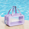 A purple washbag with a clear window is shown floating on bright blue water.