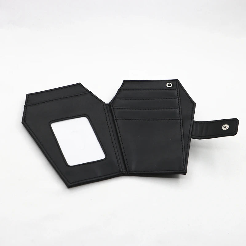 Black leather wallet with a vintage embossed design and a cutout for cards.