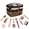 A leopard print transparent makeup bag filled with various cosmetic products and tools.
