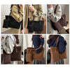 A collection of leopard print tote bags and shoulder bags in various shades of brown and black shown being carried by a woman