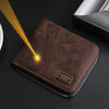 A brown leather wallet with a silver zipper, showing a bright light beam on the surface.
