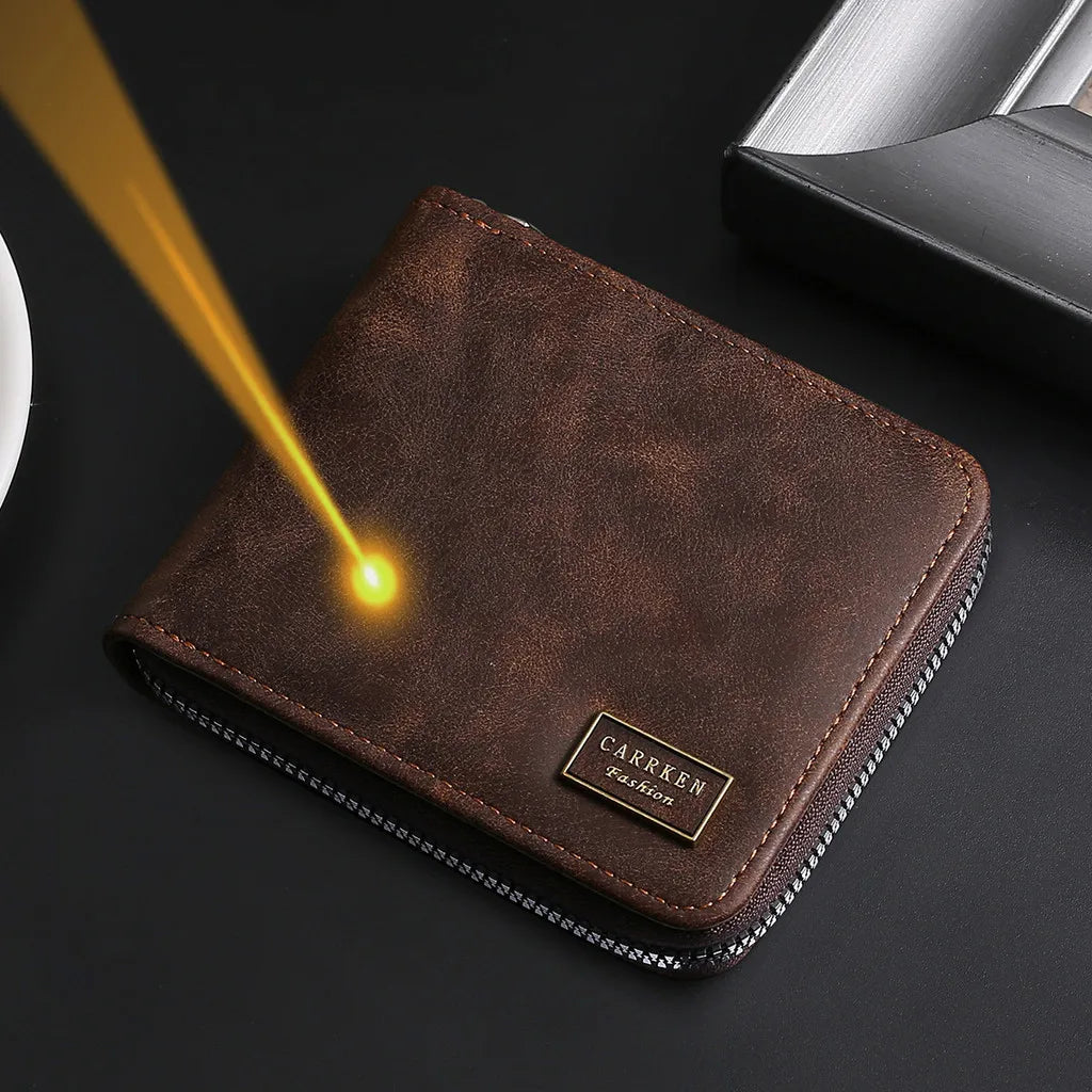 A brown leather wallet with a silver zipper, showing a bright light beam on the surface.