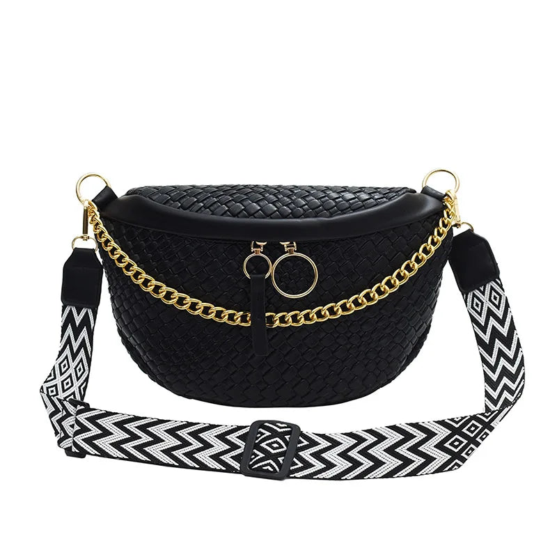 A black woven pattern waist bag with a gold chain strap is displayed against a white background.
