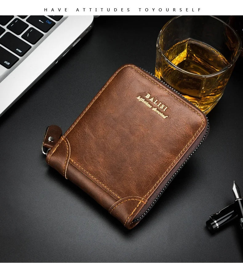 A brown leather wallet with gold stitching rests on a dark surface next to a glass of amber liquid.