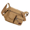 A tan canvas tool bag featuring multiple zippered pockets and adjustable straps.