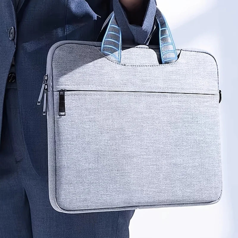 A gray premium laptop sleeve with blue accents is shown being carried by a person.
