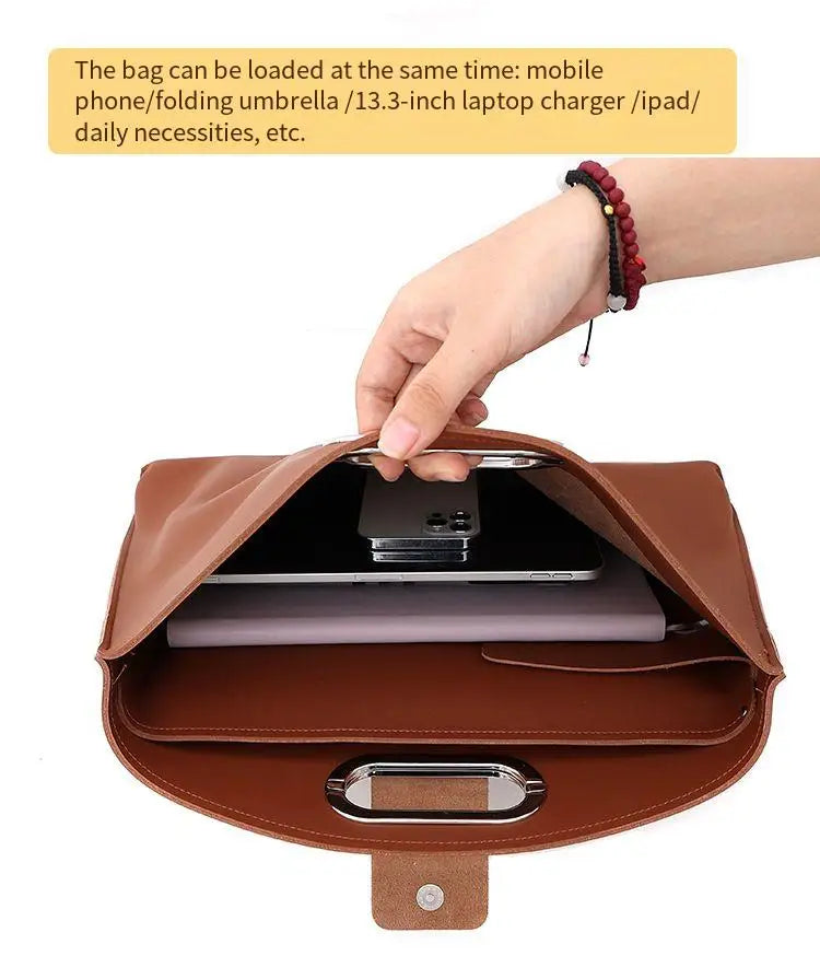 A brown leather laptop briefcase is shown open, displaying a laptop and other items.