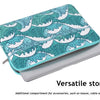 A teal laptop sleeve featuring a white and teal scale pattern, designed for versatile storage of accessories.