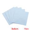 A set of ten light blue polishing cloths, measuring 8x8cm, with serrated edges.