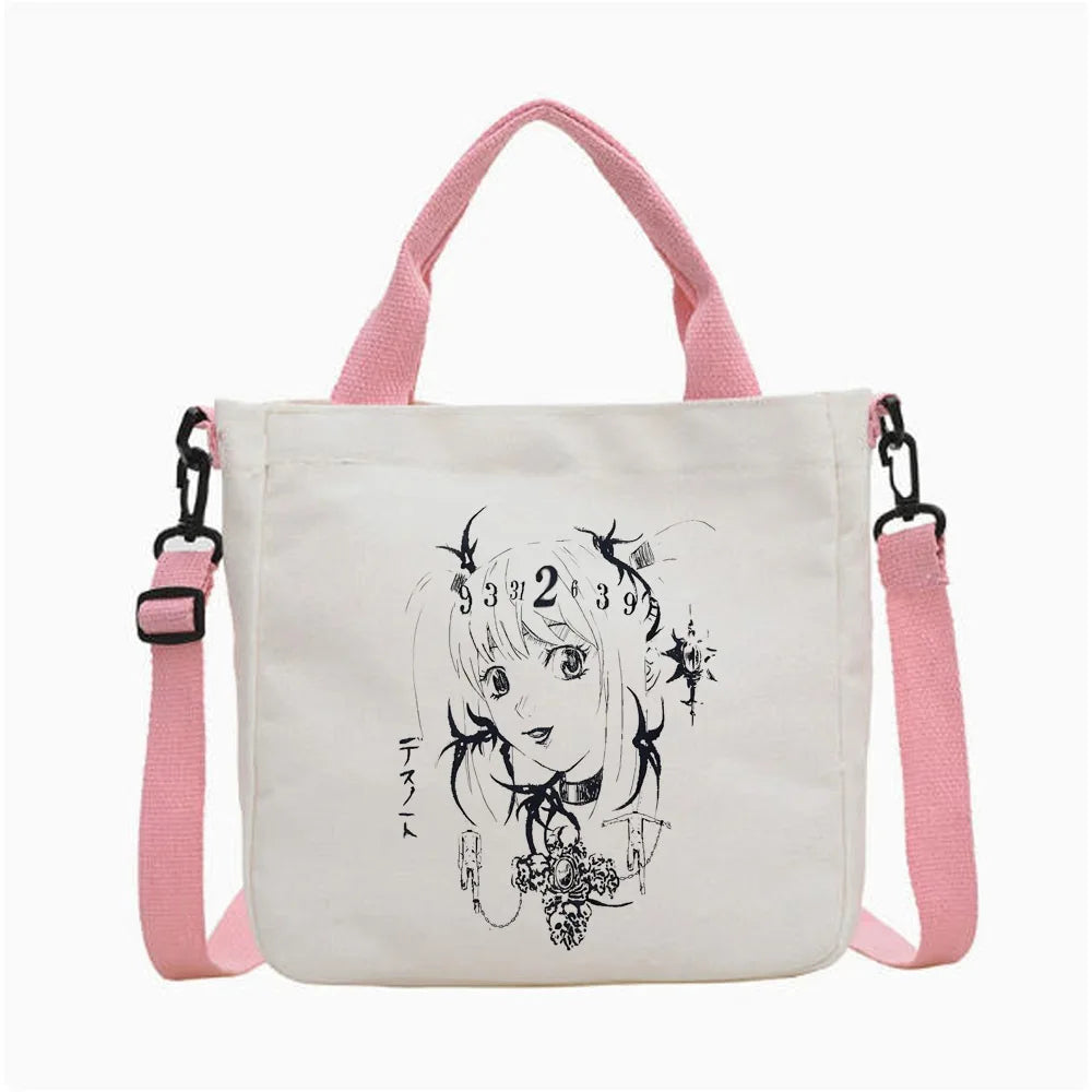 Bolso de tela blanco con correas rosas y un dibujo lineal en negro de la cara de una niña y números